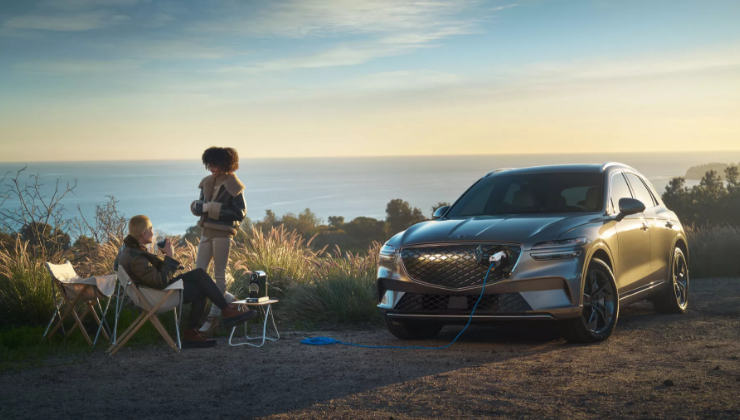Genesis electric vehicle charging at a scenic overlook.