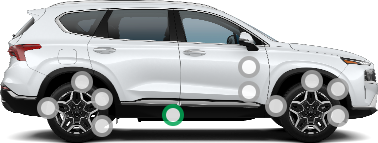 Passenger side profile of a white Hyundai Santa Fe.