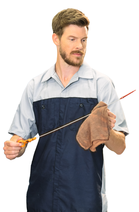 Hyundai technician checking oil level with dipstick and cloth in hand